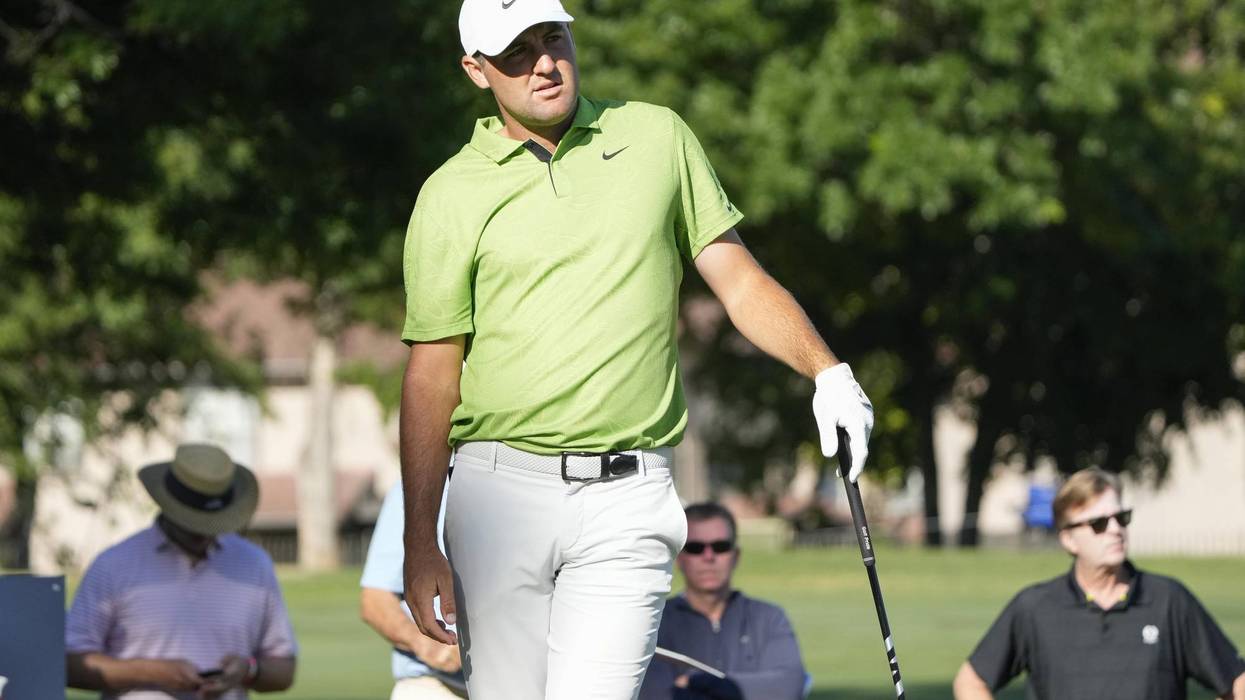Scottie Scheffler watches his tee on the 11th hole during the first round of the Charles Schwab Challenge
