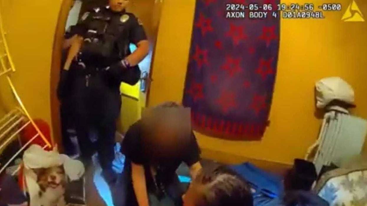 Screenshot from the body cam footage just prior to police shooting a woman that pulled a handgun.