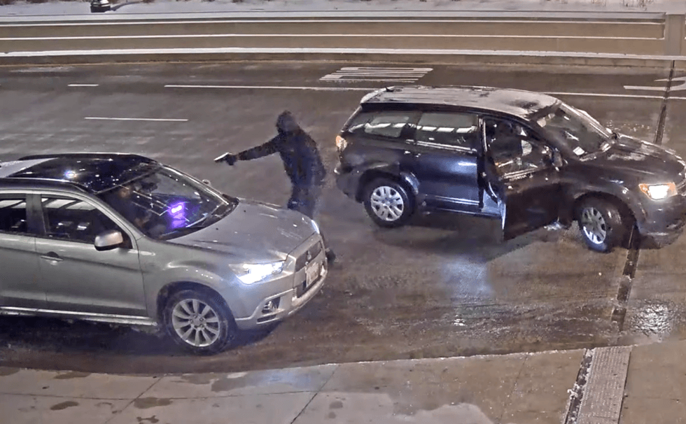Screenshot of surveillance video showing a carjacking in the 200 Block of South Wacker Place near Willis Tower.