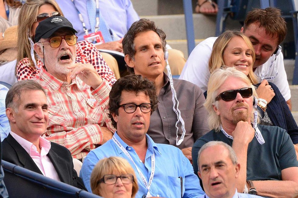 Sean Connery (L) and Ben Stiller (C) and businessman Richard Branson (bottom R) watch French tennis player Richard Gasquet play a point against Spain
