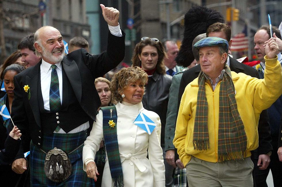 Sean Connery (L), his wife Micheline Roquebrune and New York City Mayor Michael Bloomberg wave to the crowd as they march up Sixth Avenue during the world