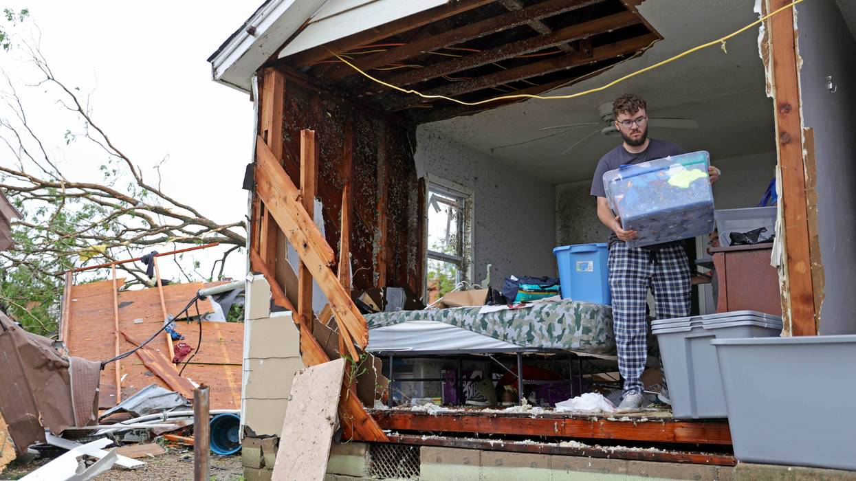 Sean Thomas Sledd salvages items from his room after it was hit by a tornado the night before in Sulphur, Okla., Sunday, April 28, 2024.