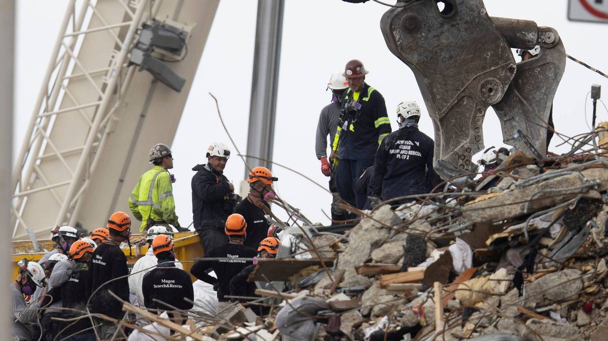 Search and rescue teams look for possible survivors in Surfside, Florida.