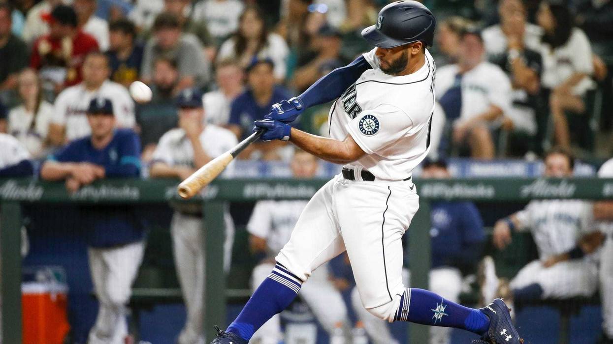 Seattle Mariners pinch hitter Abraham Toro (13) hits a two run home run against the Houston Astros during the ninth inning at T-Mobile Park.