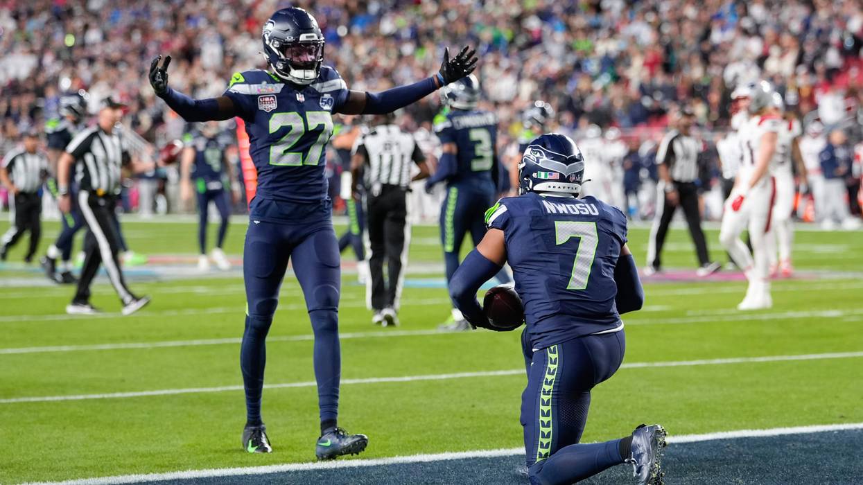 Seattle Seahawks linebacker Uchenna Nwosu (7) celebrates his touchdown on a fumble recovery with cornerback Riq Woolen (27) running during the second half of the NFL Super Bowl 60 football game, Sunday, Feb. 8, 2026, in Santa Clara, Calif.
