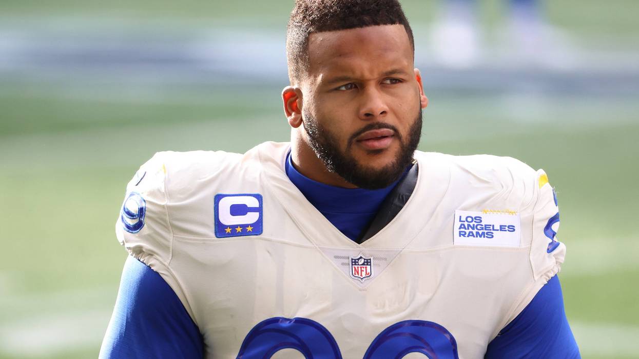 SEATTLE, WASHINGTON - JANUARY 09: Defensive end Aaron Donald #99 of the Los Angeles Rams looks on during pre-game activates prior to the NFC Wild Card Playoff game against the Seattle Seahawks at Lumen Field on January 09, 2021 in Seattle, Washington.