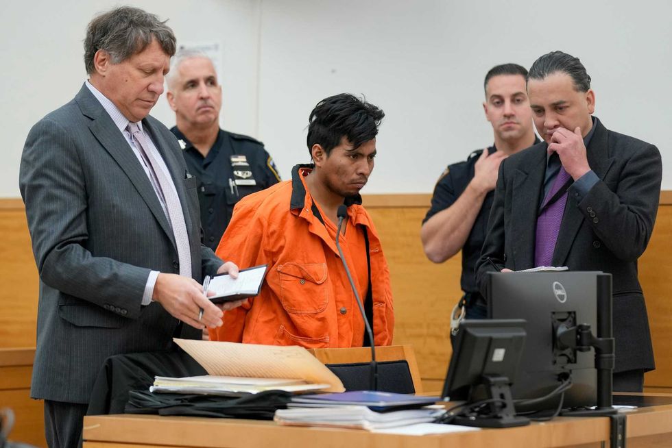 Sebastian Zapeta, center, accused of burning a woman to death inside a New York City subway train, appears in Kings County Supreme Court for an arraignment, Tuesday, Jan. 7, 2025, in New York