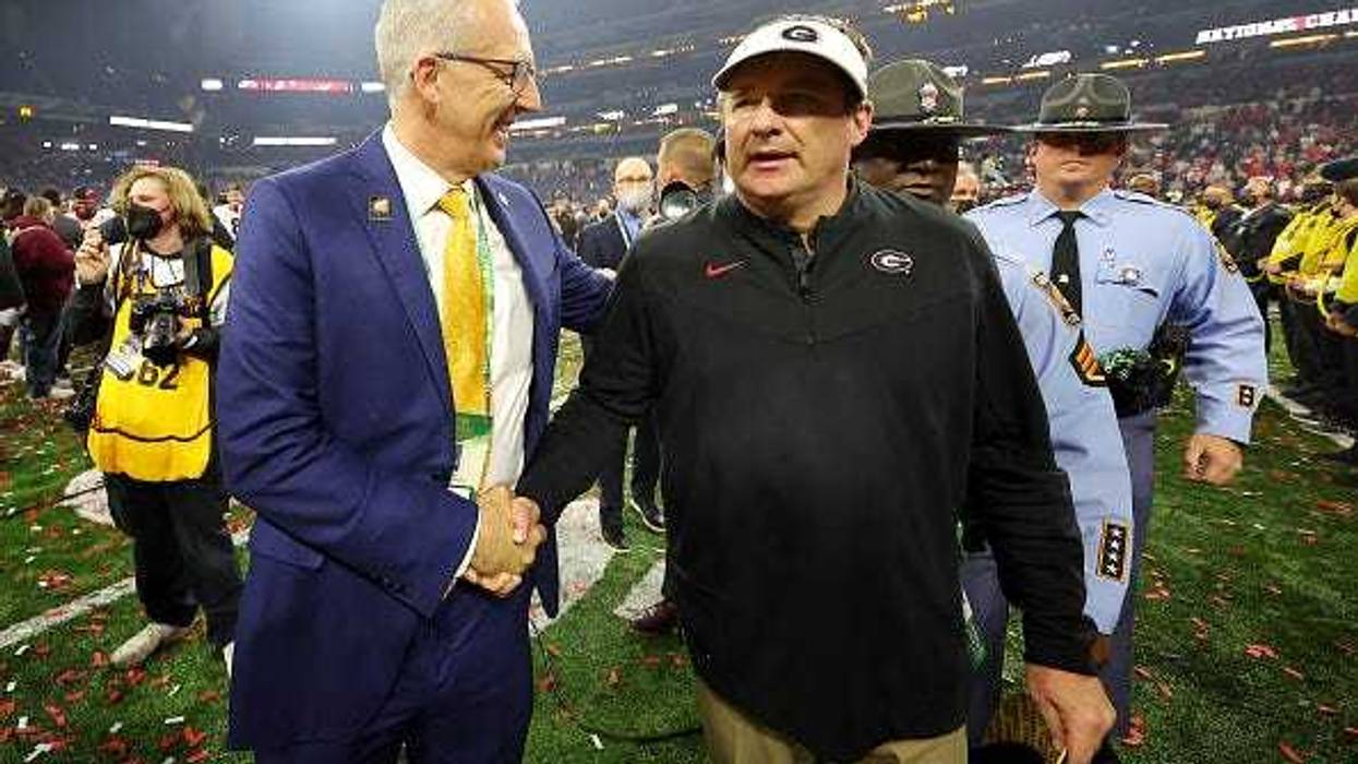 SEC Commissioner Greg Sankey congratulates Georgia head coach Kirby Smart