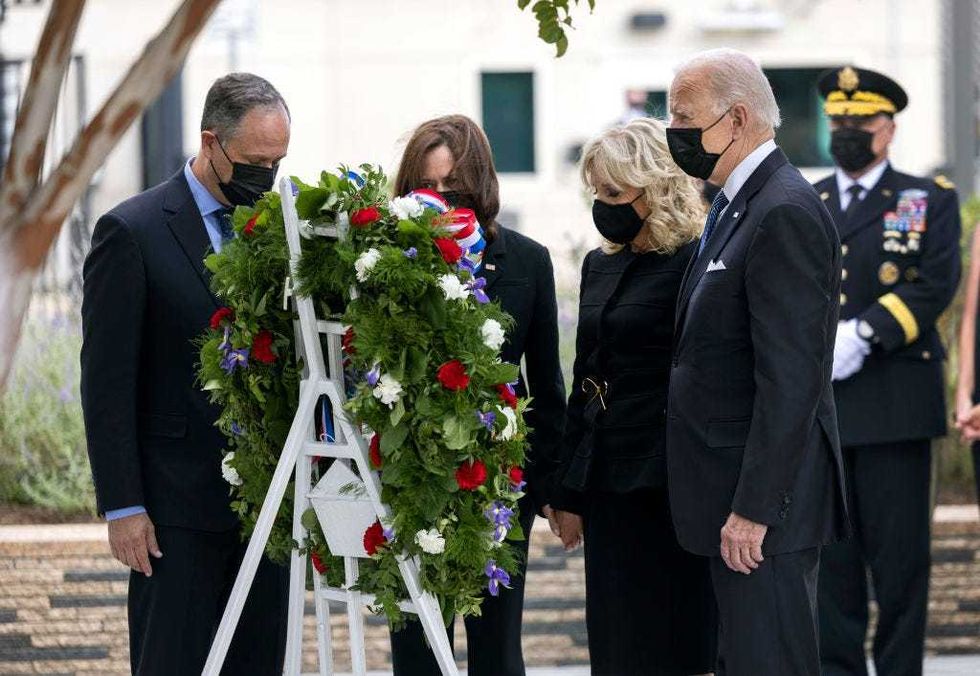 Second Gentleman Doug Emhoff, Vice President Kamala Harris, First Lady Jill Biden and President Joe Biden, participate in a wreath-laying ceremony on September 11, 2021 in Arlington, Virginia.