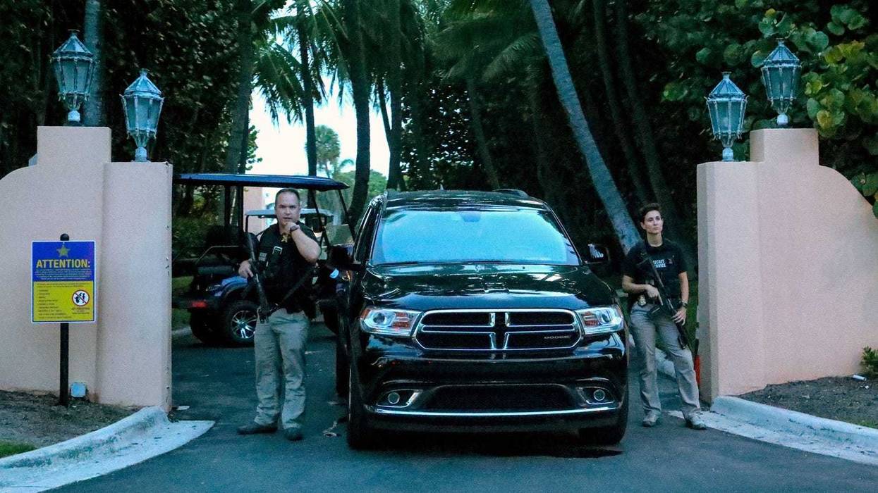Secret service agents stand at the gate of Mar-a-Lago after the FBI issued warrants at August 8, 2022 in Palm Beach, Fla.