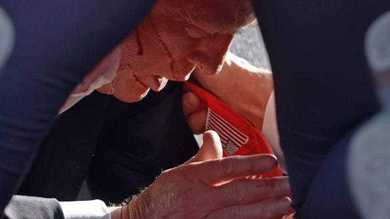 Secret Service tend to republican presidential candidate former President Donald Trump onstage at a rally on July 13, 2024 in Butler, Pennsylvania.