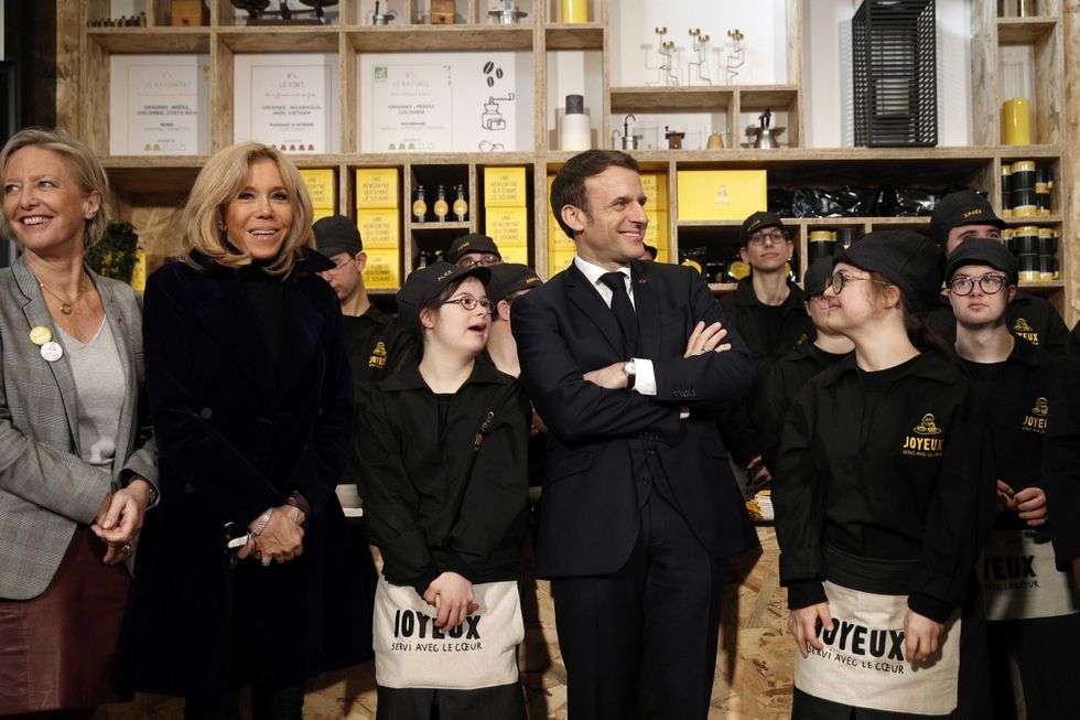 Secretary of State in charge of People with Disabilities Sophie Cluze (L), French President