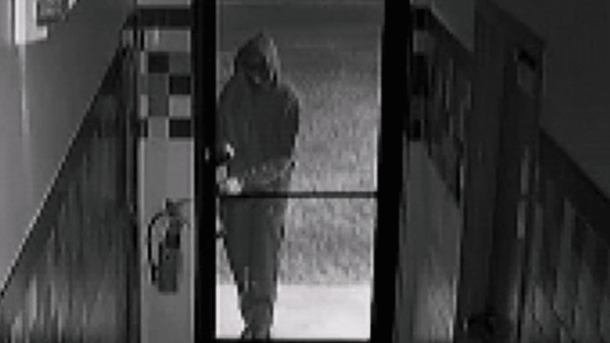 Security camera image shows suspect in hoodie, dark, hard to see
