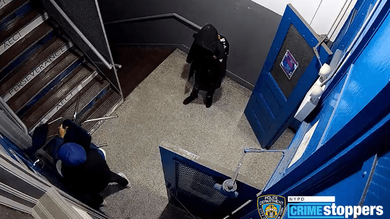 Security cameras captured footage of two of the burglars smashing a window with a chair.