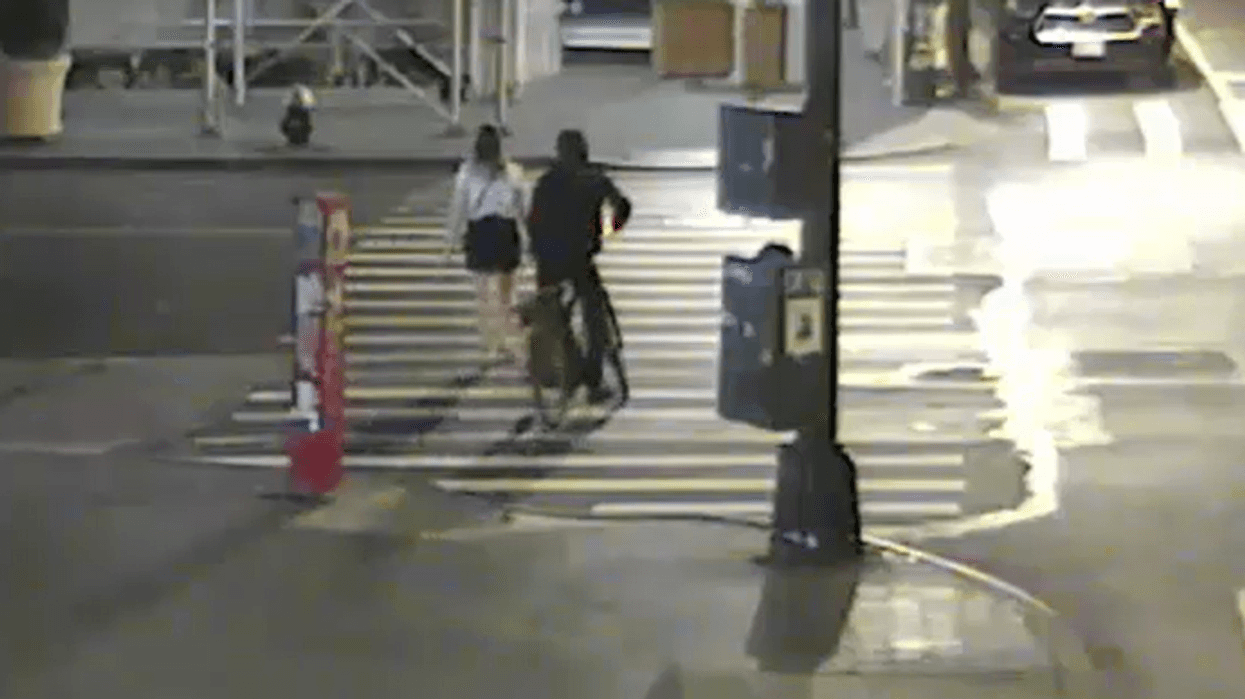 Security footage of the attacker riding up behind one of his victims.