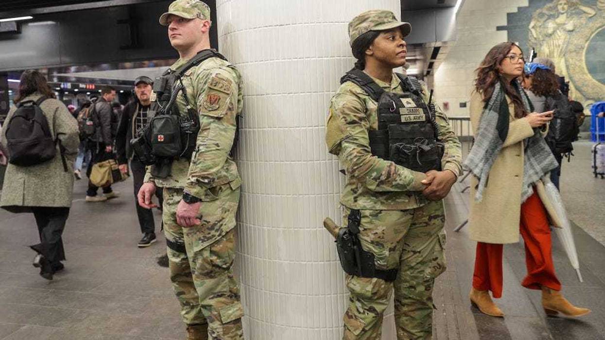 Security forces, including National Guard troops and police, take security measures at a subway station in New York, United States on March 7, 2024.