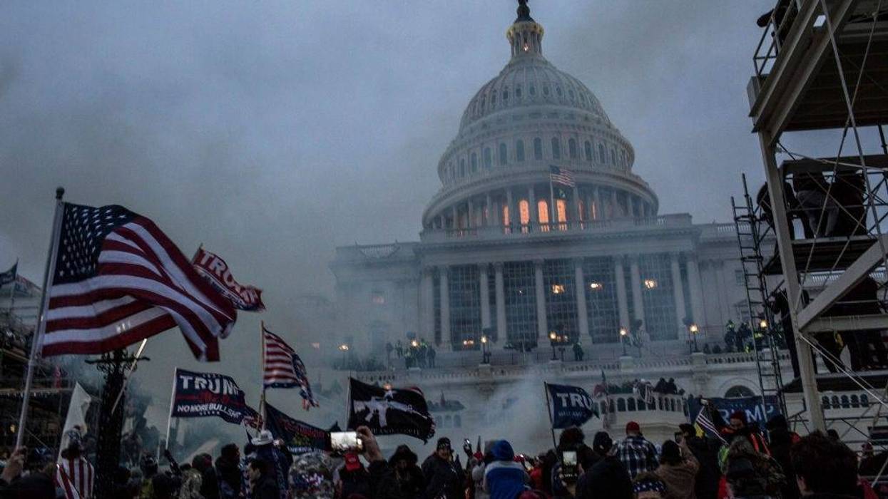 Security forces respond with tear gas after the US President Donald Trump's supporters breached the US Capitol security.