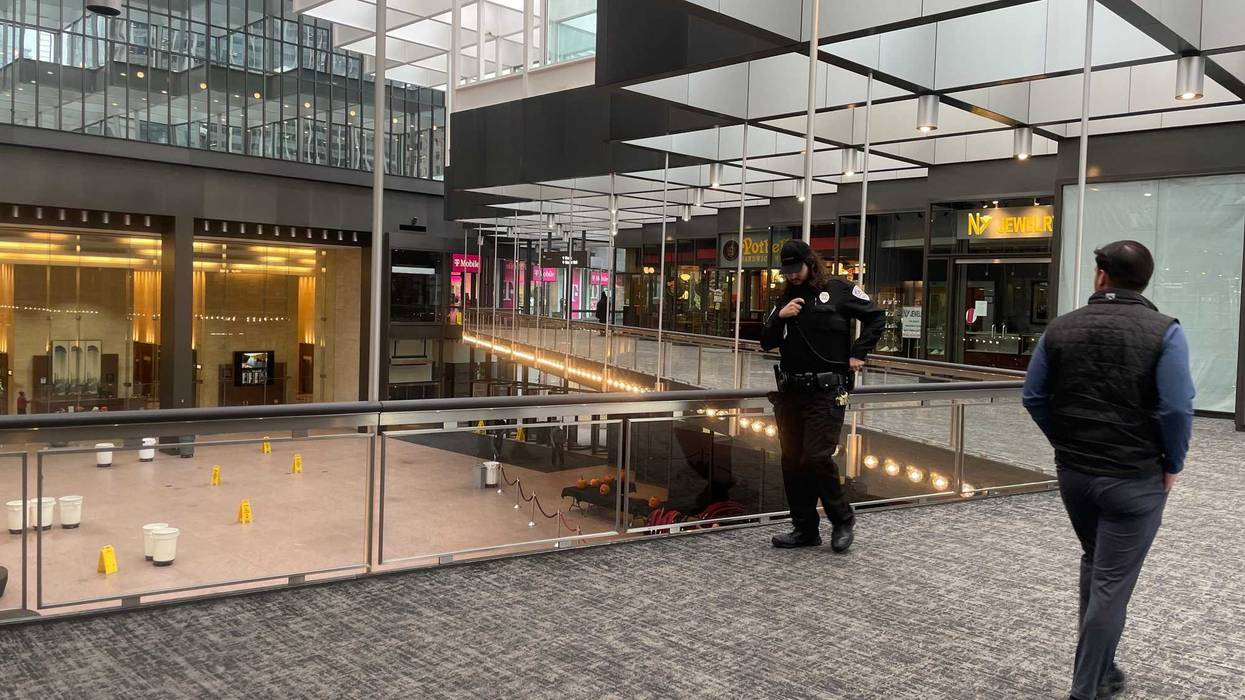 Security guards were busy keeping people out of the IDS Crystal Court Thursday after heavy snow dropped one of the glass panes.