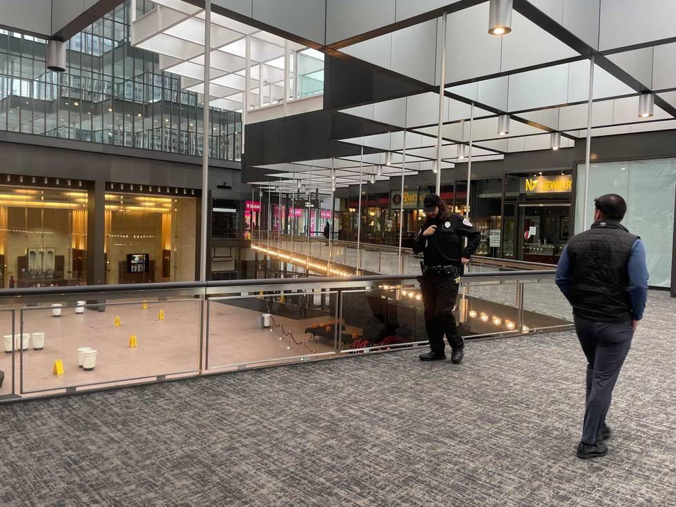 Security guards were busy keeping people out of the IDS Crystal Court Thursday after heavy snow dropped one of the glass panes.