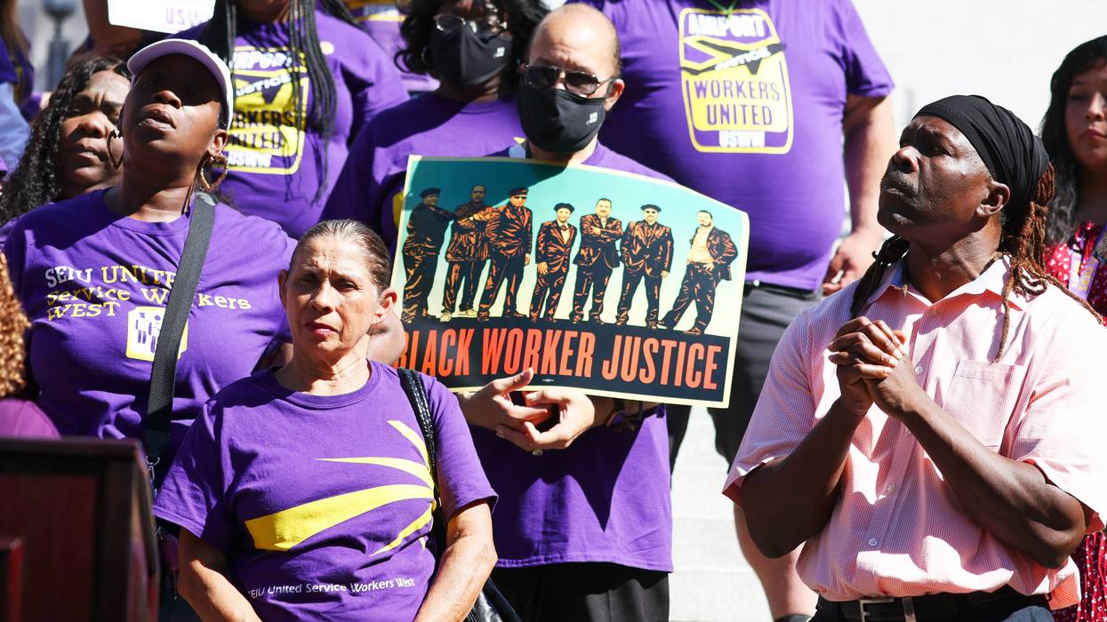 SEIU California union members stand at a demonstration outside City Hall calling for the resignations of L.A. City Council members Kevin de Leon and Gil Cedillo in the wake of a leaked audio recording on October 18, 2022 in Los Angeles, California.