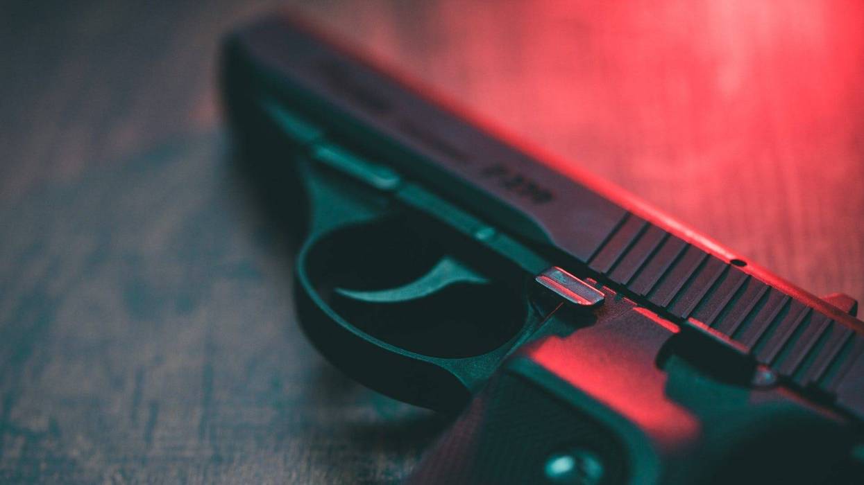 Semi automatic hand gun and red light