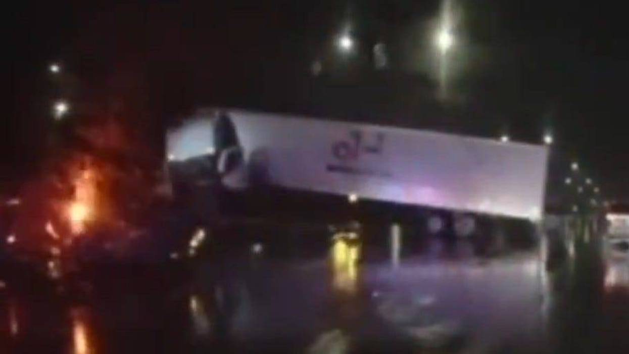 Semi crashes into median wall on I-696.