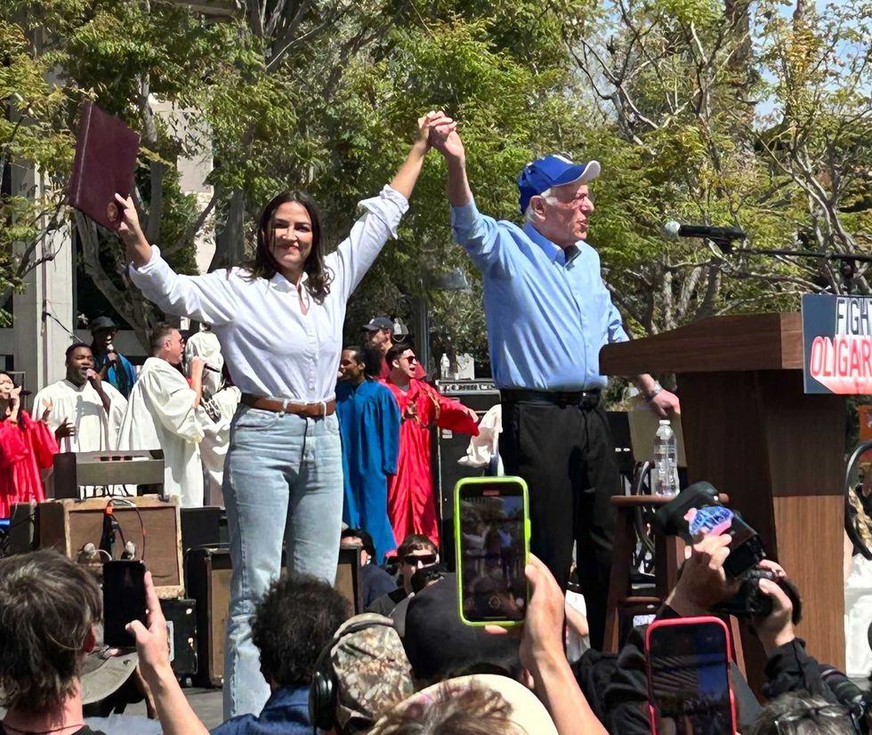 Sen. Bernie Sanders (I-Vt.) and Rep. Alexandria Ocasio-Cortez (D-N.Y.) at the "Fighting Oligarchy" rally on April 12, 2025 in Los Angeles, Calif.