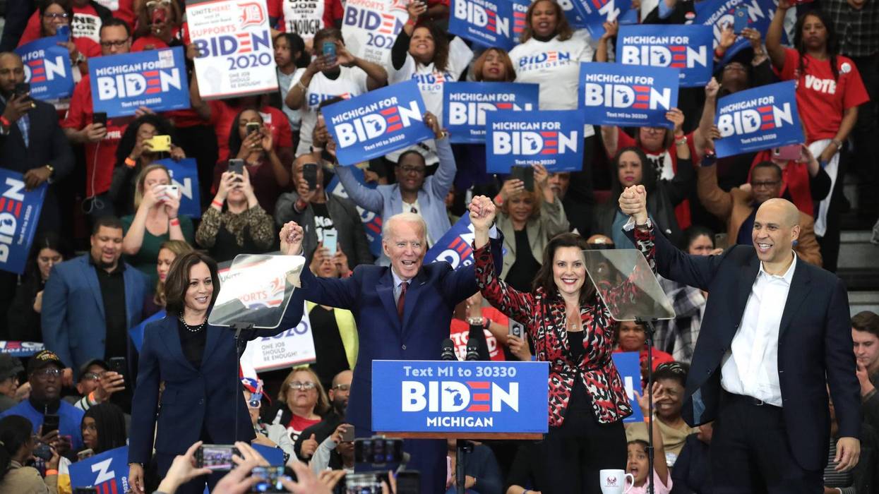 Sen. Kamala Harris (L) (D-CA), Sen. Cory Booker (R)(D-NJ), and Michigan Governor Gretchen Whitmer join Democratic presidential candidate former Vice President Joe Biden on stage at a campaign rally at Renaissance High School on March 09, 2020 in Detroit.