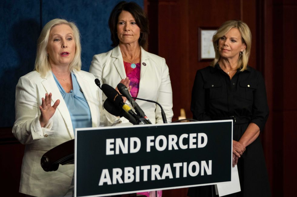 Sen. Kirsten Gillibrand (D-NY), Rep. Cheri Bustos (D-IL) and former Fox News broadcast journalist Gretchen Carlson hold a press conference to announce bipartisan legislation to empower sexual assault and harassment survivors on Capitol Hill July 14, 2021 in Washington, DC.