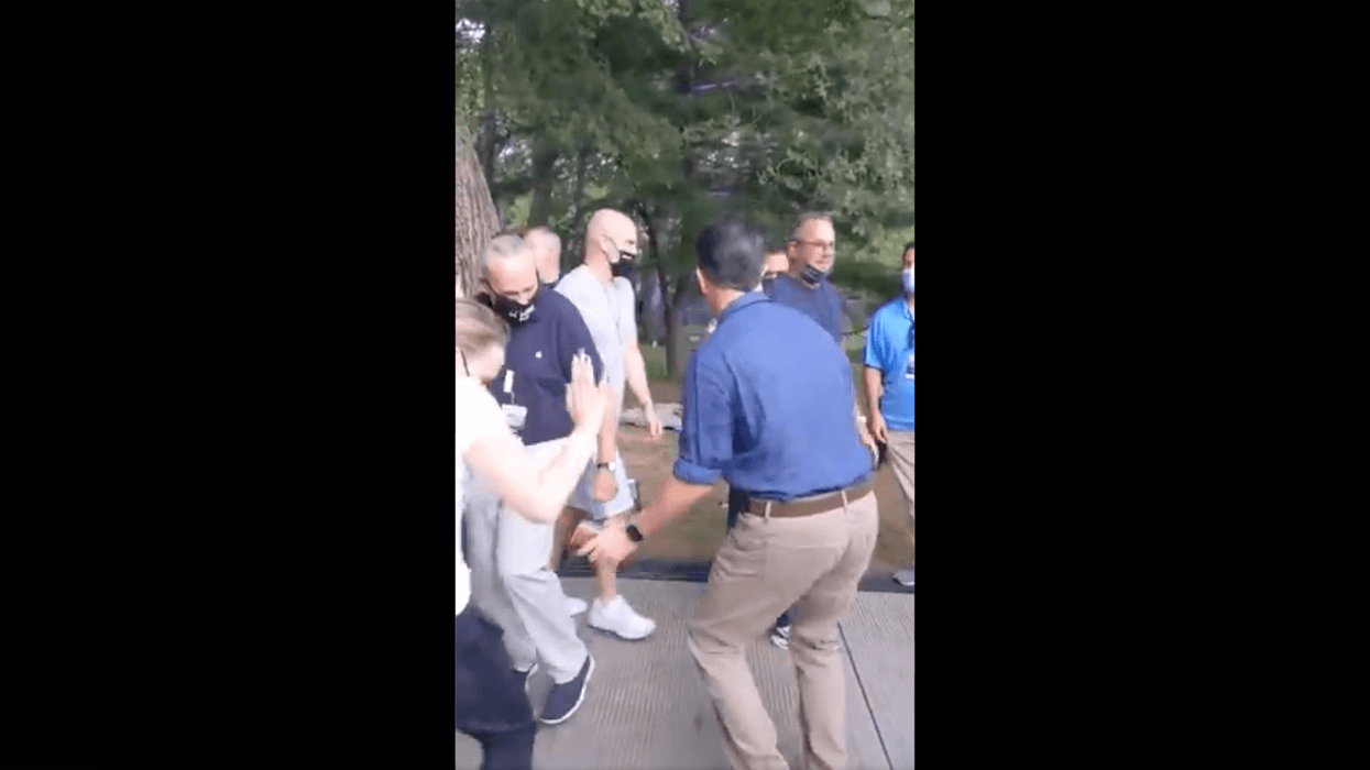 Sen. Majority Leader Chuck Schumer and late-night host Stephen Colbert dance backstage at the rained-out We Love NYC concert on Saturday, Aug. 21, 2021.
