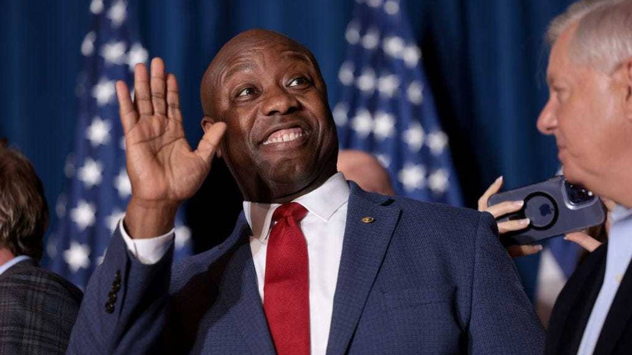 Sen. Tim Scott (R-SC) cheers on Republican presidential candidate and former President Donald Trump speaks during an election night watch party at the State Fairgrounds on February 24, 2024 in Columbia, South Carolina.