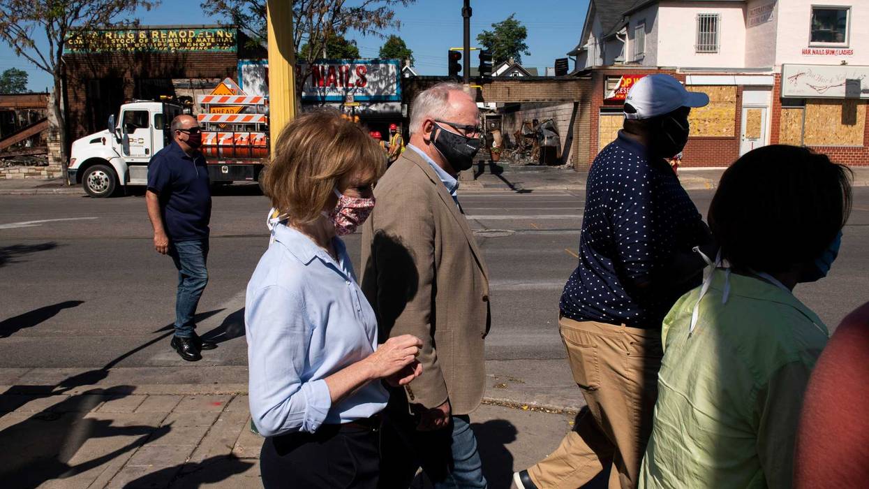 Sen. Tina Smith (D-MN), Minnesota Governor Tim Walz, Minnesota State Sen. Jeff Hayden, and Sen. Amy Klobuchar (D-MN) tour buildings damaged near East Lake Street during the protests and riots that followed the death of George Floyd on June 5, 2020 in Minneapolis, Minnesota. Local business owners and community members spoke with the politicians about the damage to their businesses and the expected impact on the neighborhood.