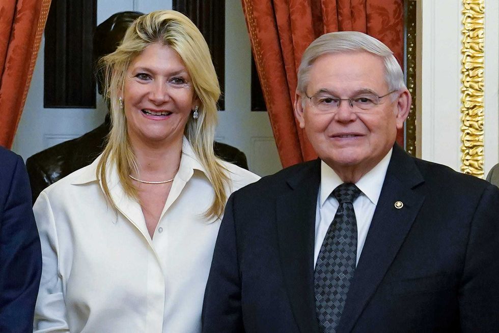 Senate Foreign Relations Committee Chairman, Sen. Bob Menendez, D-N.J., right, and his wife Nadine Arslanian, pose for a photo on Capitol Hill in Washington, Dec. 20, 2022