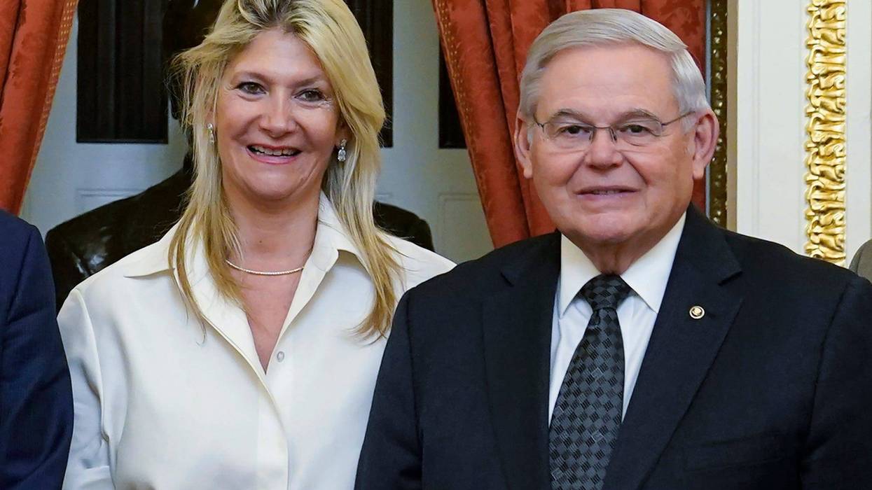 Senate Foreign Relations Committee Chairman, Sen. Bob Menendez, D-N.J., right, and his wife Nadine Arslanian, pose for a photo on Capitol Hill in Washington, Dec. 20, 2022.