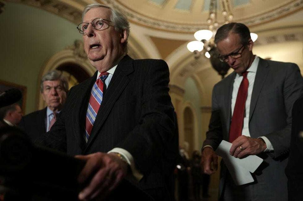 Senate Minority Leader Sen. Mitch McConnell (R-KY) (2nd L) speaks as Sen. Roy Blunt (R-MO) (L) and Senate Minority Whip Sen. John Thune (R-SD) (R) listen during a news briefing after a weekly Senate Republican policy luncheon at the U.S. Capitol March 8, 2022 in Washington, DC