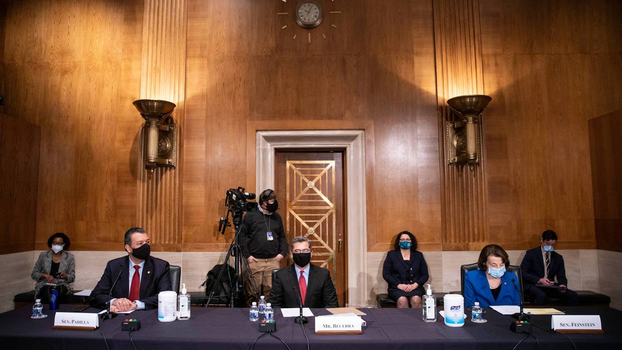 Senator Alex Padilla (D-CA), Xavier Becerra, Secretary of Health and Human Services (HHS) nominee, and Senator Dianne Feinstein (D-CA) attend Becerra's confirmation hearing before the Senate Health, Education, Labor and Pensions Committee on February 23, 2021 in Washington, DC.