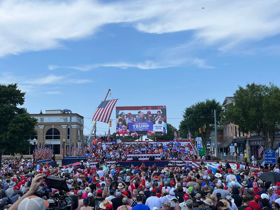 Senator Lindsey Graham attempts to address a booing crowd