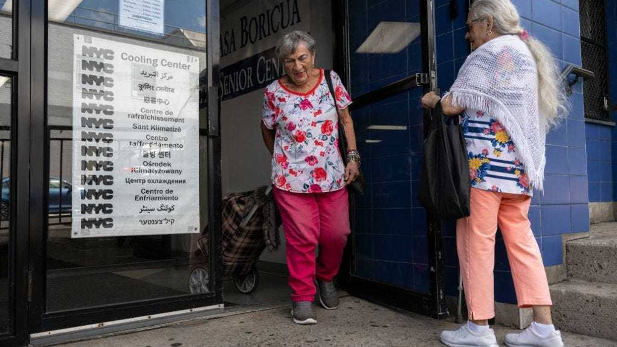 Senior citizens leave a cooling center during a summer heat wave in the Bronx borough of New York on July 11, 2024.