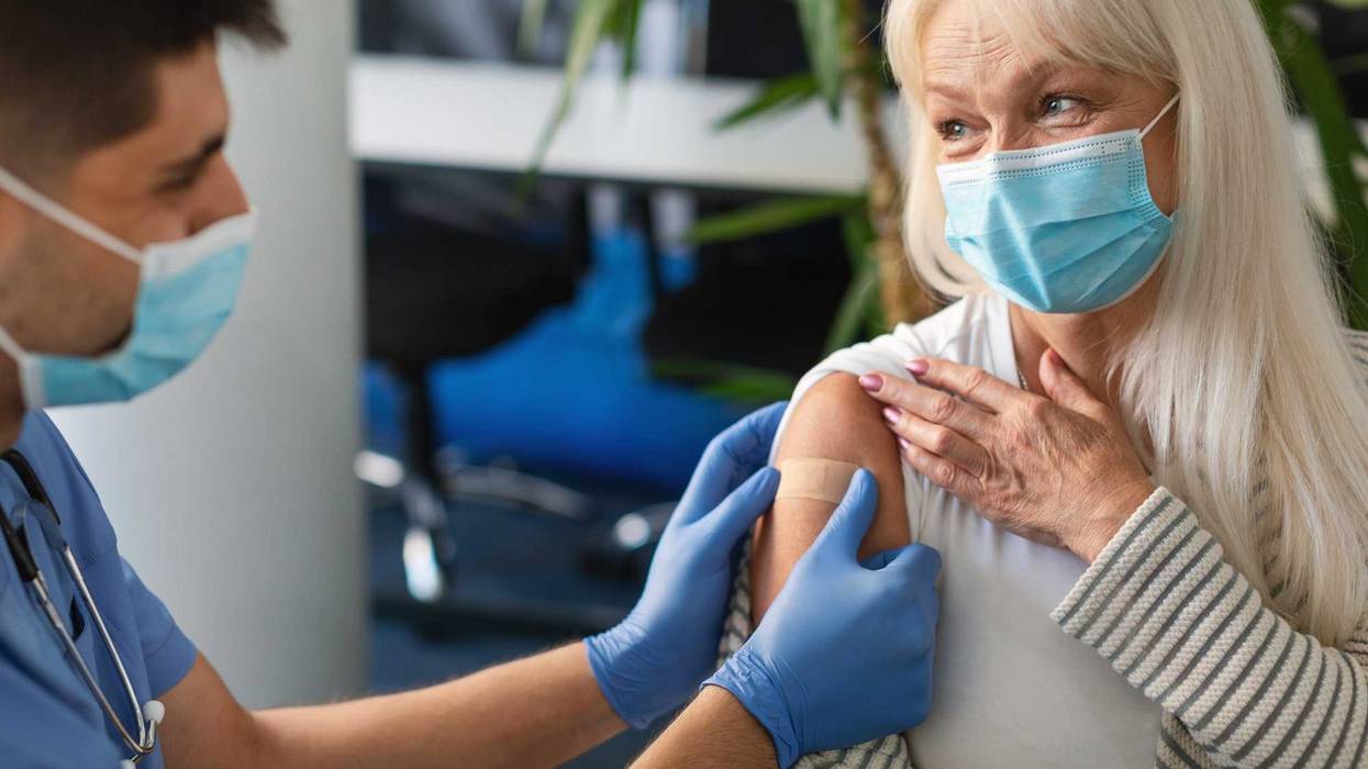 Senior getting vaccinated stock photo.