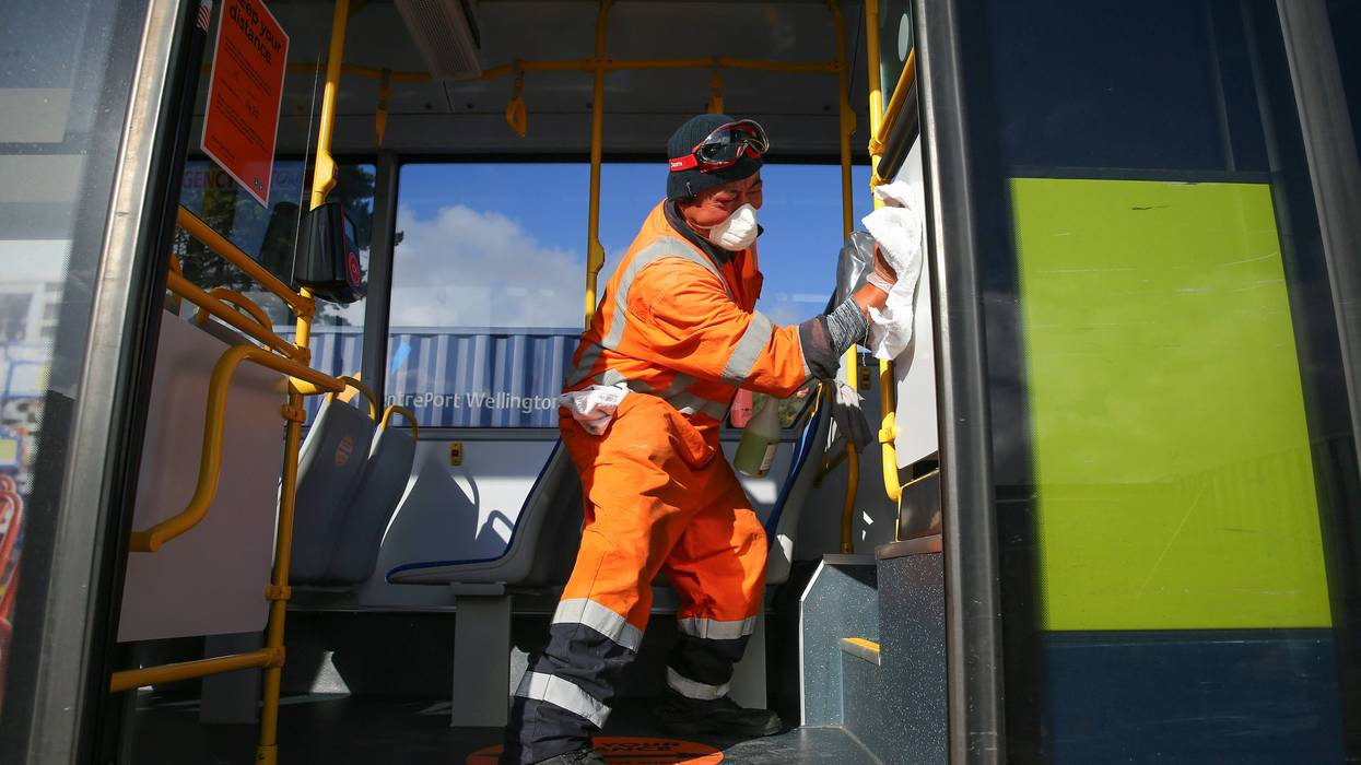 Senior Yard Supervisor Lipi Vitolio disinfects the interior surface of a bus at Tranzit Bus Depot on May 09, 2020 in Wellington, New Zealand.