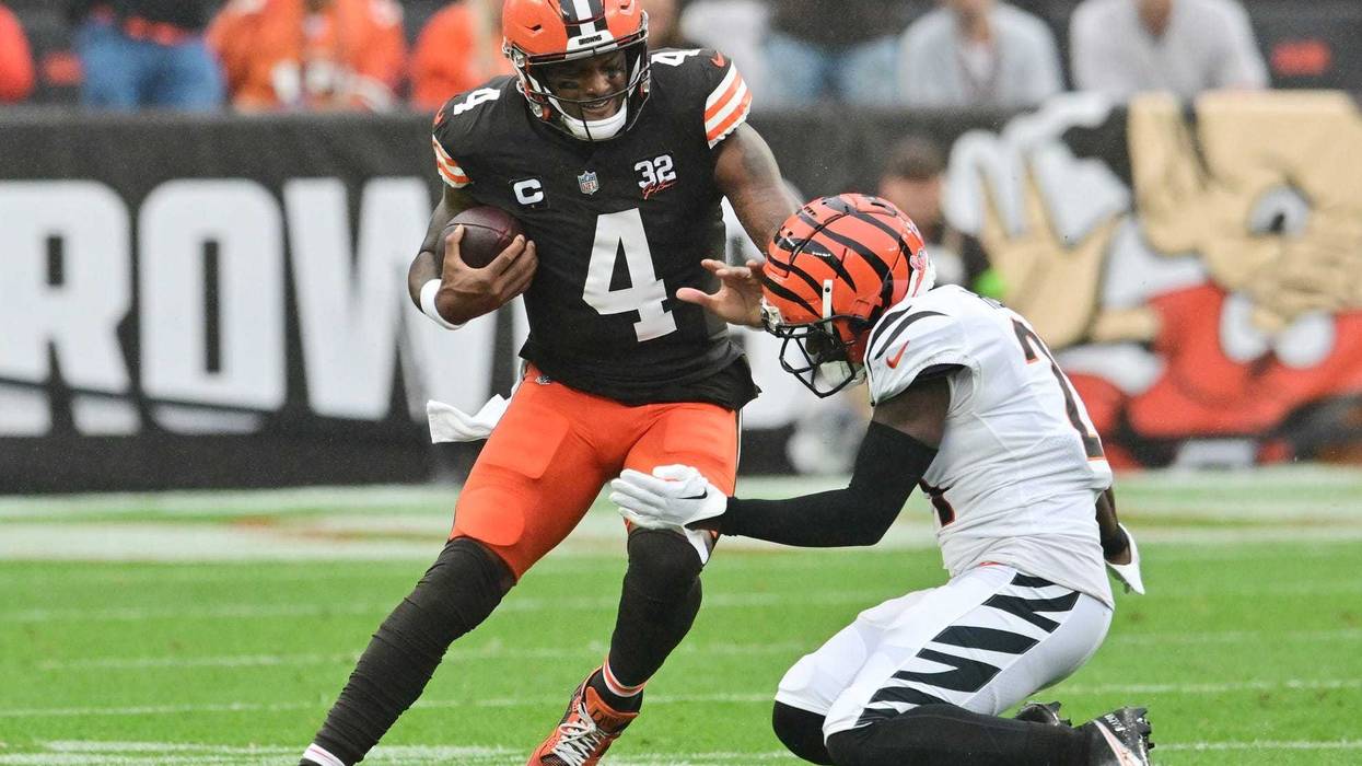 Sep 10, 2023; Cleveland, Ohio, USA; Cincinnati Bengals cornerback Mike Hilton (21) tackles Cleveland Browns quarterback Deshaun Watson (4) during the first half at Cleveland Browns Stadium. Mandatory Credit: Ken Blaze-USA TODAY Sports