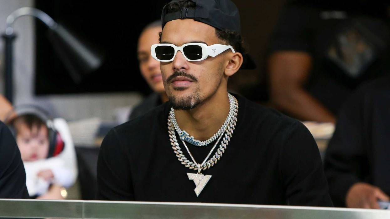 Sep 11, 2022; Atlanta, Georgia, USA; Atlanta Hawks guard Trae Young (11) sits in a suite before a game between the Atlanta Falcons and New Orleans Saints at Mercedes-Benz Stadium.