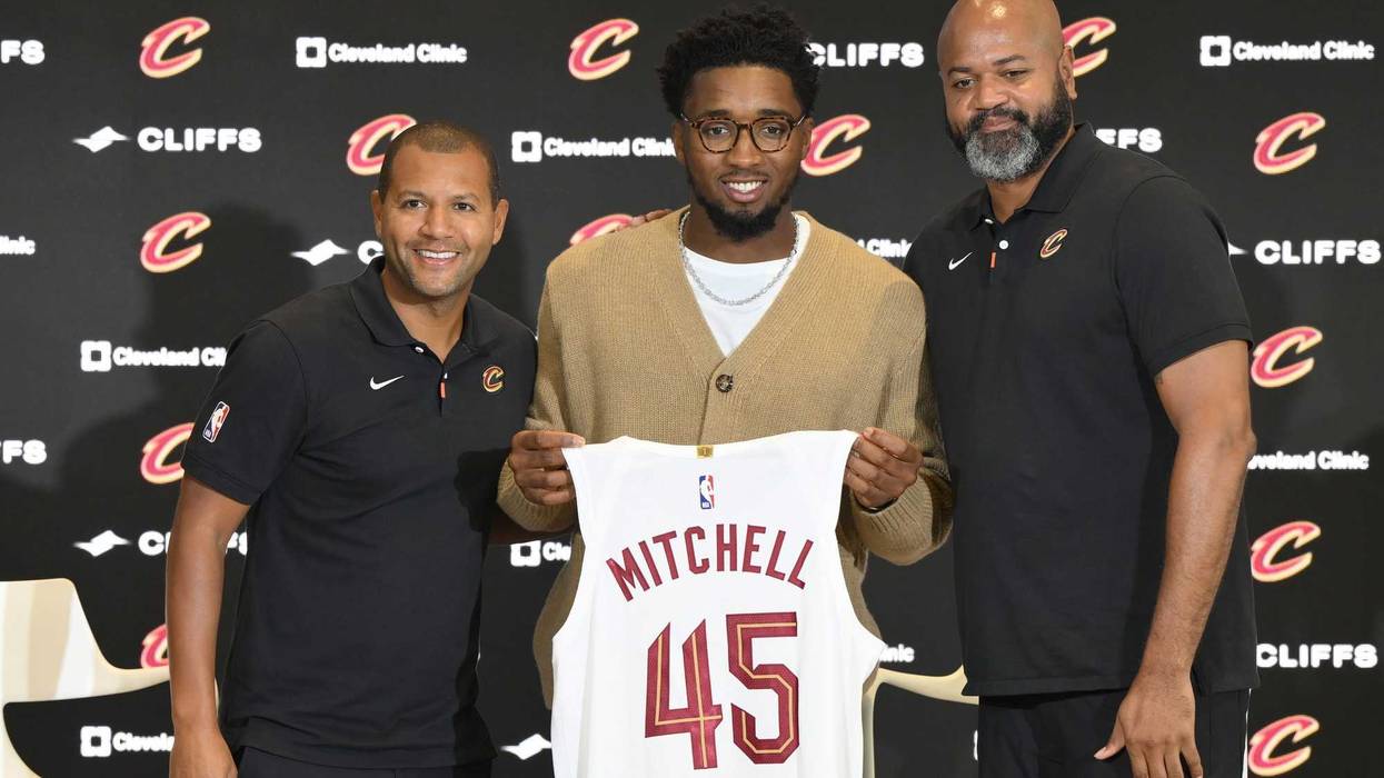 Sep 14, 2022; Cleveland, OH, USA; Cleveland Cavaliers guard Donovan Mitchell (center) poses with team president of basketball operations Koby Altman (left) and head coach J.B. Bickerstaff during an introductory press conference at Rocket Mortgage FieldHouse.