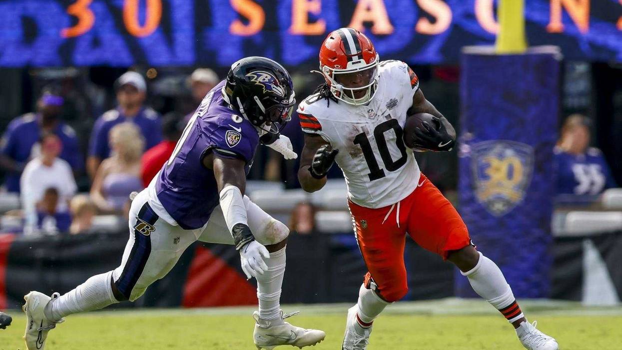Sep 14, 2025; Baltimore, Maryland, USA; Cleveland Browns running back Quinshon Judkins (10) runs the ball against Baltimore Ravens linebacker Roquan Smith (0) during the fourth quarter at M&T Bank Stadium.