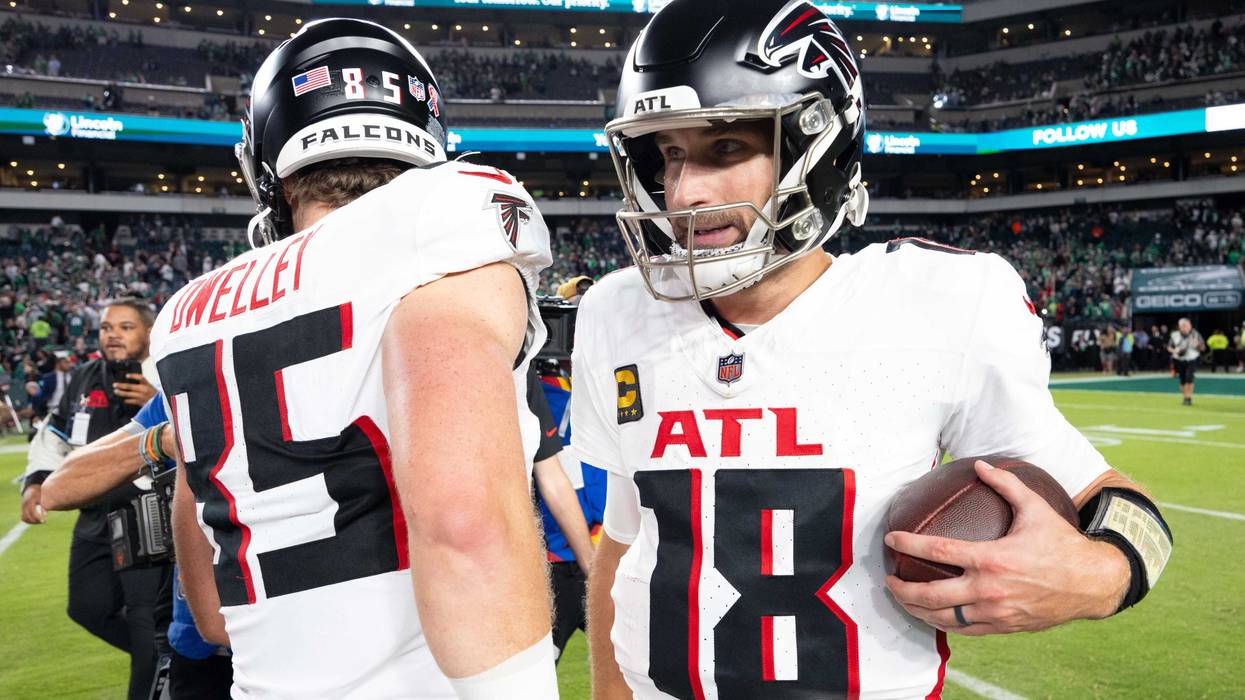 Sep 16, 2024; Philadelphia, Pennsylvania, USA; Atlanta Falcons quarterback Kirk Cousins (18) hugs tight end Ross Dwelley (85) after a victory against the Philadelphia Eagles at Lincoln Financial Field. Mandatory Credit: Bill Streicher-Imagn Images