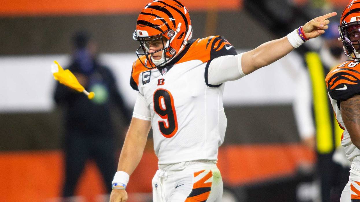Sep 17, 2020; Cleveland, Ohio, USA; Cincinnati Bengals quarterback Joe Burrow (9) signals to the Cleveland Browns for an encroachment penalty as a flag is thrown during the third quarter at FirstEnergy Stadium. Mandatory Credit: Scott Galvin-USA TODAY Spo