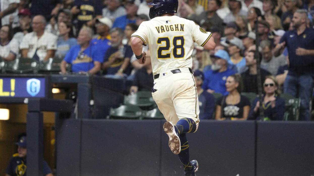 Sep 18, 2025; Milwaukee, Wisconsin, USA; Milwaukee Brewers first base Andrew Vaughn (28) scores a run against the Los Angeles Angels in the fourth inning at American Family Field. Mandatory Credit: Michael McLoone-Imagn Images