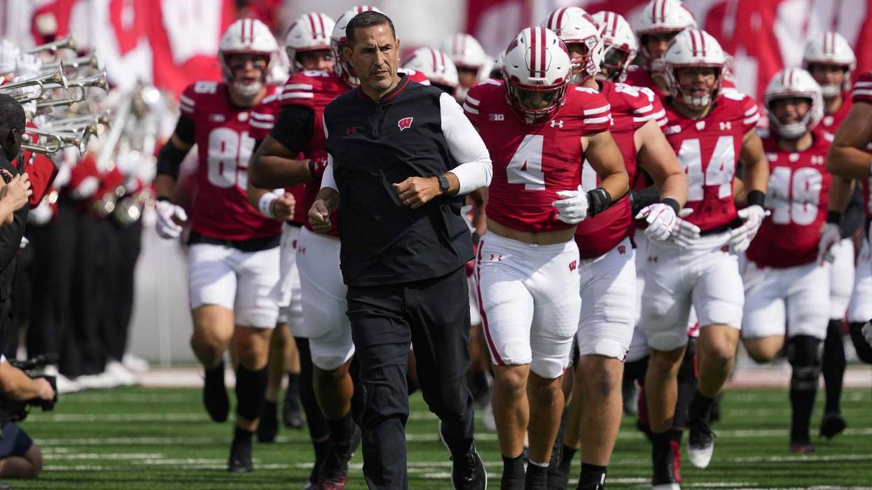 Sep 20, 2025; Madison, Wisconsin, USA; Wisconsin Badgers head coach Luke Fickell runs onto the field ahead of players prior to the game against the Maryland Terrapins at Camp Randall Stadium. Mandatory Credit: Jeff Hanisch-Imagn Images
