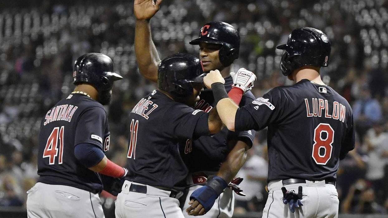 Sep 24, 2019; Chicago, IL, USA; Cleveland Indians third baseman Jose Ramirez (11) is congratulated by teammates after his grand slam in the first inning against the Chicago White Sox at Guaranteed Rate Field. Mandatory Credit: Quinn Harris-USA TODAY Sport