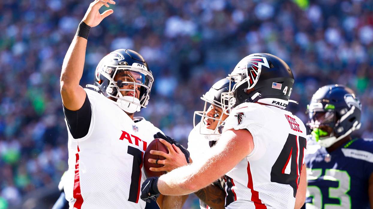 Sep 25, 2022; Seattle, Washington, USA; Atlanta Falcons quarterback Marcus Mariota (1) celebrates after rushing for a touchdown against the Seattle Seahawks during the first quarter at Lumen Field.